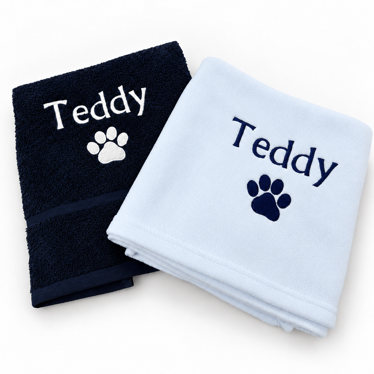 Navy towel with white Teddy embroidery and pale baby blue blanket with navy embroidery