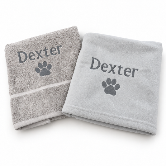 Grey towel and fleece blanket embroidered Dexter with dark grey paw prints