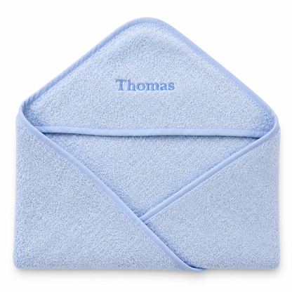Blue hooded baby towel with Thomas embroidery on a clean white background.