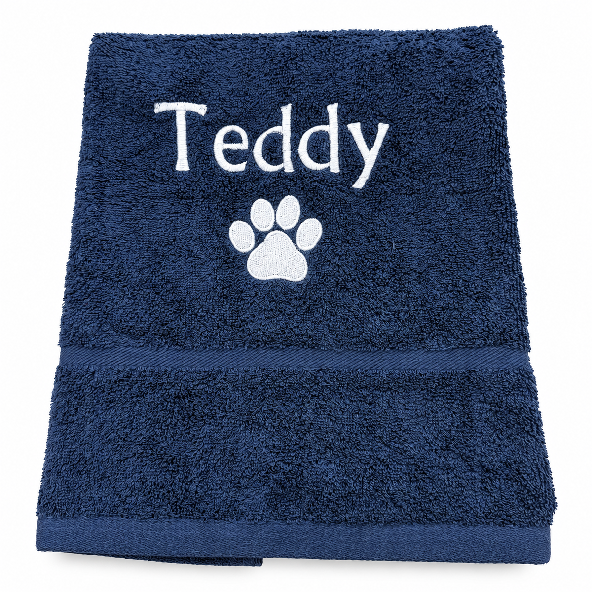 Navy personalised dog hand towel with Teddy embroidered above a white paw print